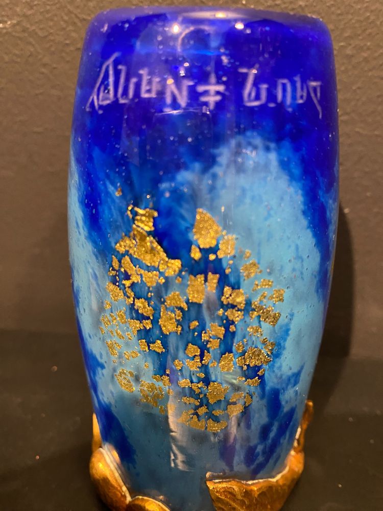 Daum vase with cicada motif and gold leaf inclusionCrystal vase with a blue nuanced backgroun