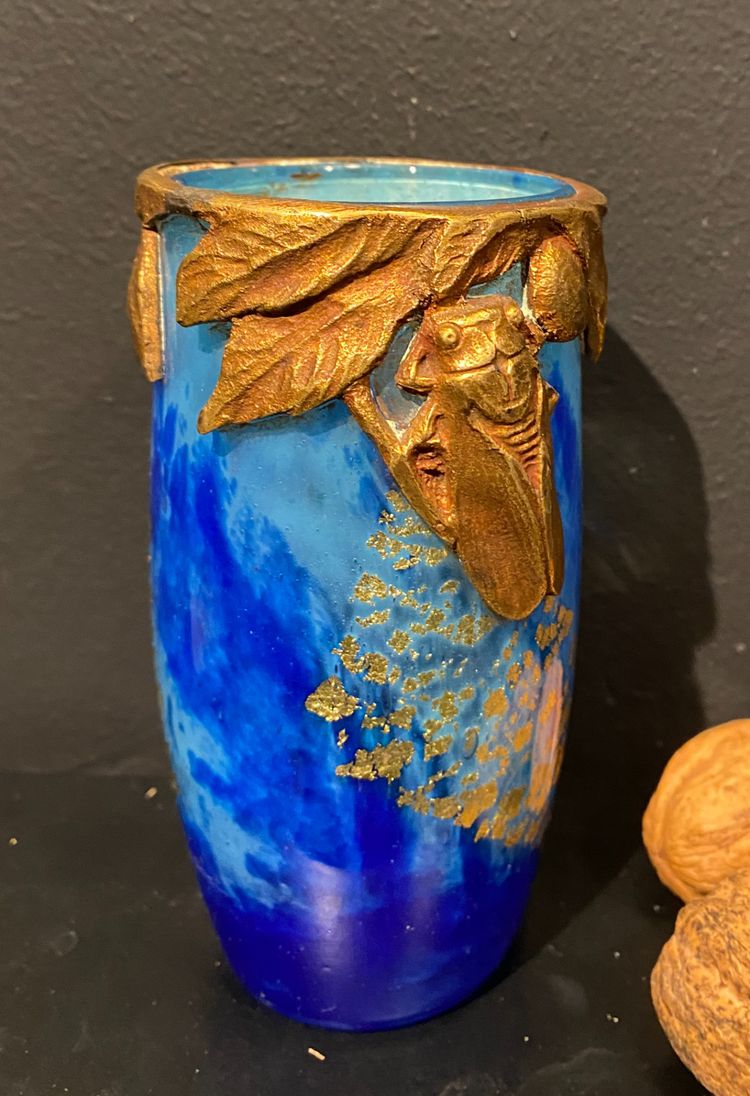 Daum vase with cicada motif and gold leaf inclusionCrystal vase with a blue nuanced backgroun