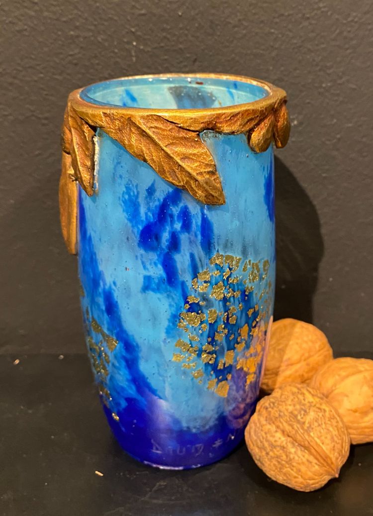 Daum vase with cicada motif and gold leaf inclusionCrystal vase with a blue nuanced backgroun