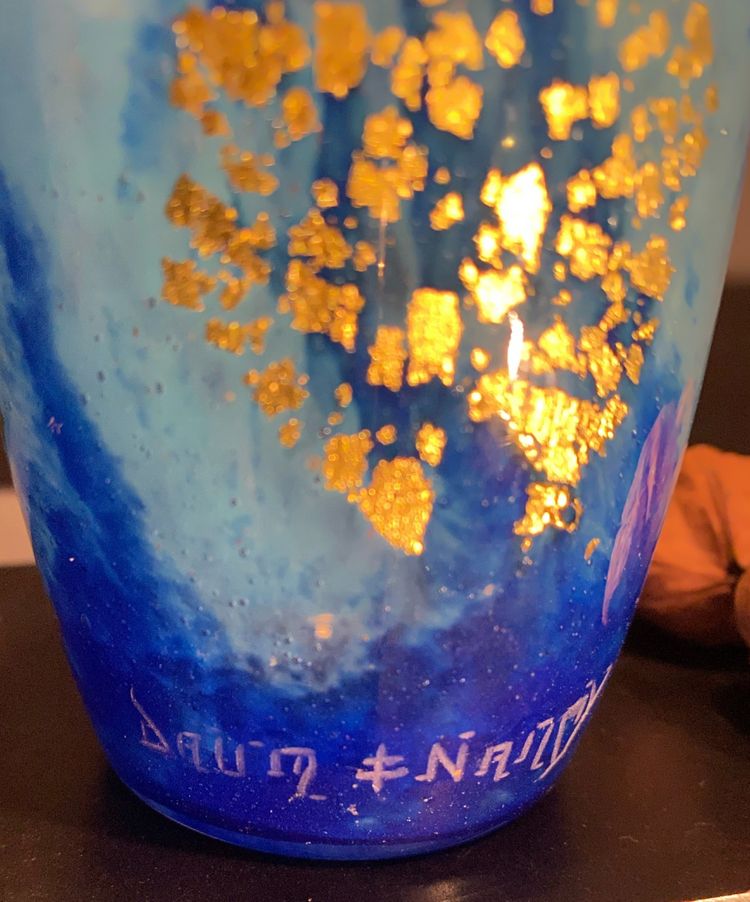 Daum vase with cicada motif and gold leaf inclusionCrystal vase with a blue nuanced backgroun