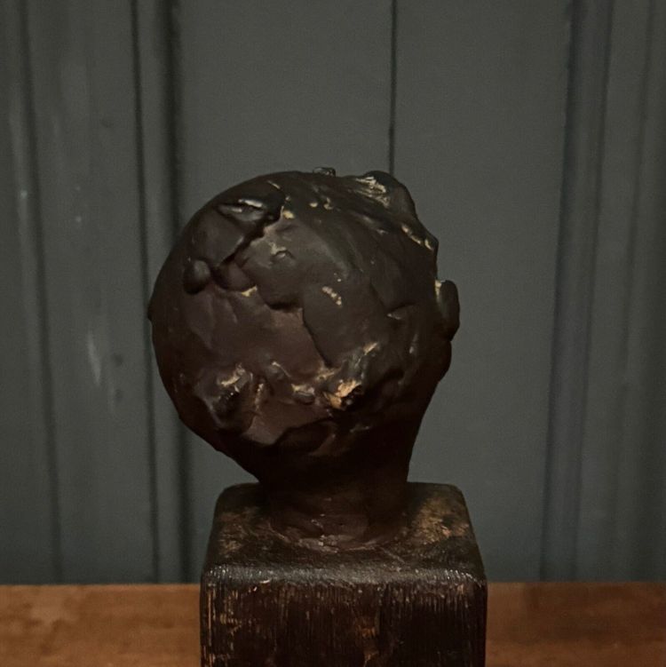 Studio plaster by Charles Filleul depicting a young boy on a wooden base